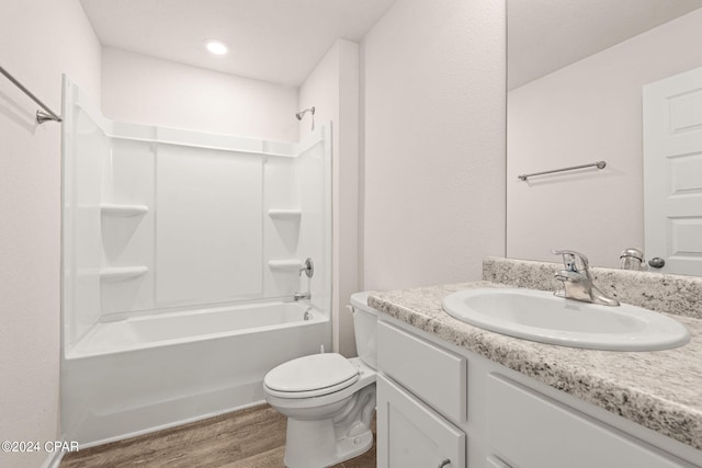 4925 Conner Ln, Panama City, FL 32404 - full bath featuring wood finished floors, toilet, vanity, and bathtub / shower combination