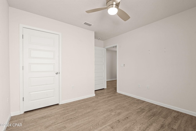 unfurnished bedroom with light hardwood / wood-style flooring and ceiling fan