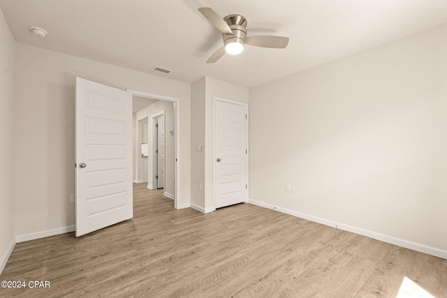 unfurnished bedroom with light wood-type flooring and ceiling fan