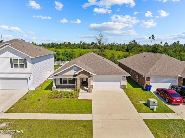 view of front of house with a garage and a front lawn