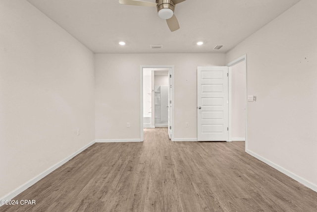 spare room featuring ceiling fan and light hardwood / wood-style floors