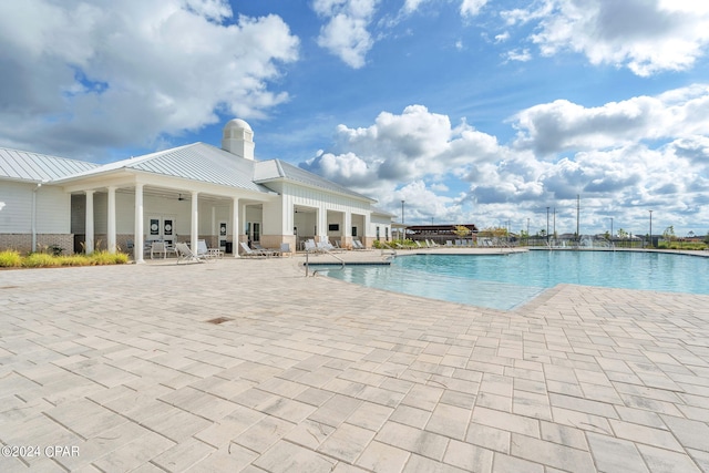 view of swimming pool with a patio area