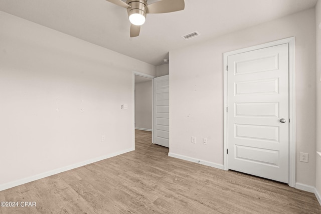 unfurnished bedroom with light hardwood / wood-style floors and ceiling fan