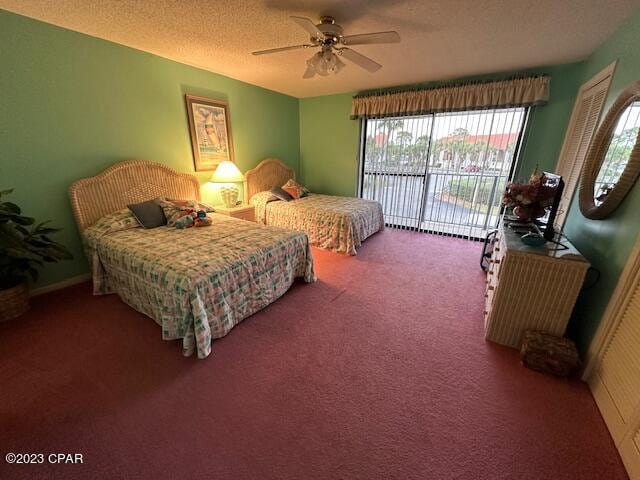 carpeted bedroom with a textured ceiling, access to outside, and ceiling fan