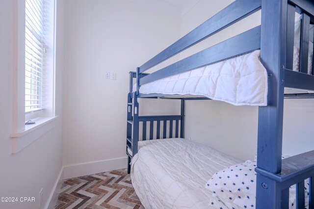 bedroom featuring parquet floors