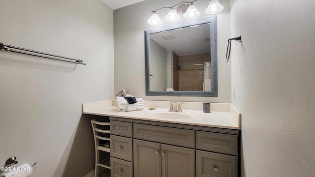 bathroom featuring a shower with curtain and vanity