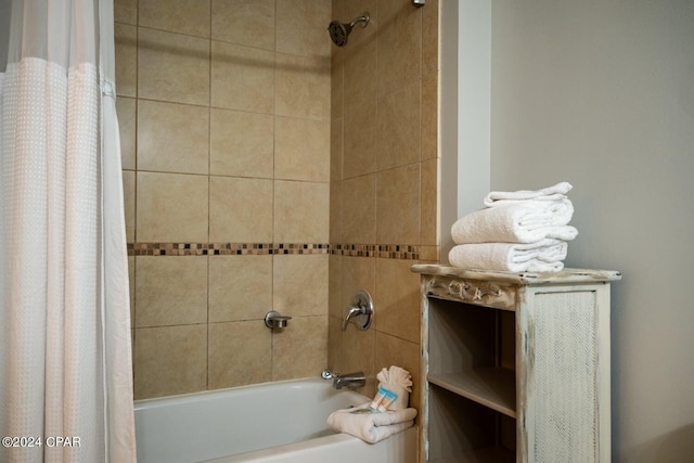 bathroom featuring shower / tub combo with curtain