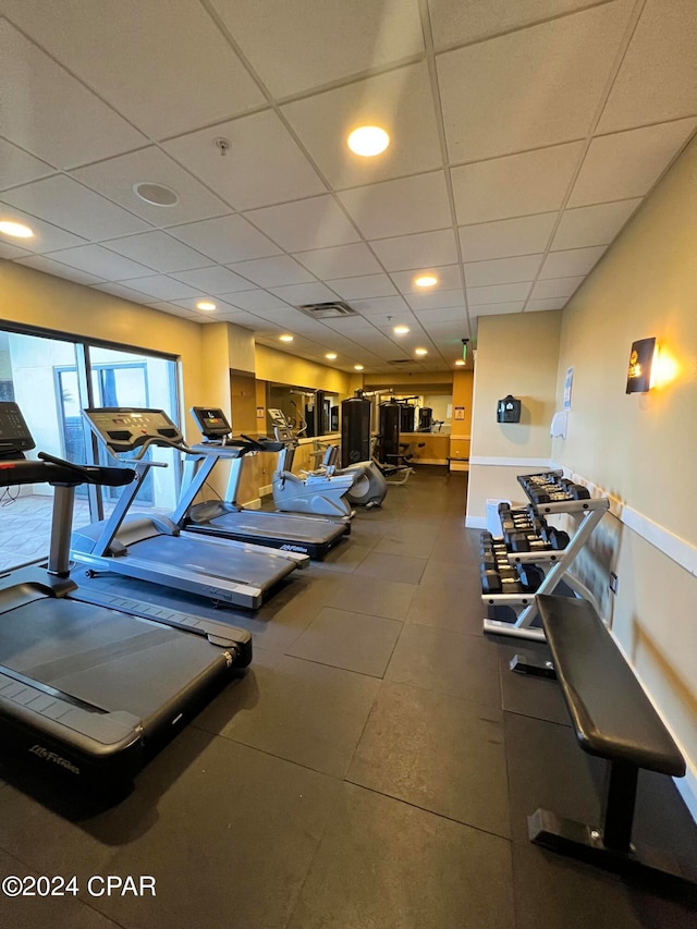 gym featuring a drop ceiling