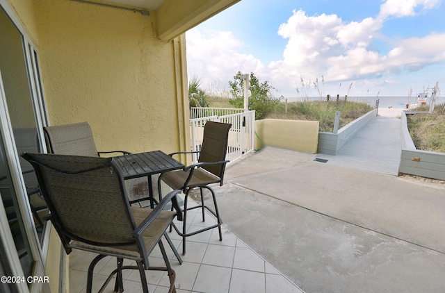 view of patio with a water view