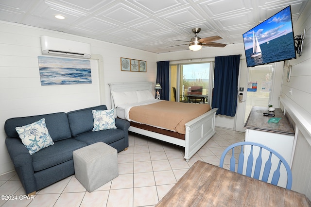 bedroom featuring light tile patterned flooring, an AC wall unit, and ceiling fan