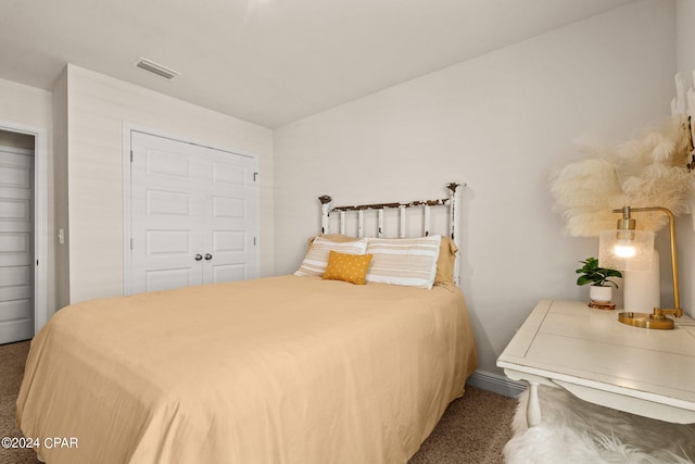 carpeted bedroom featuring a closet