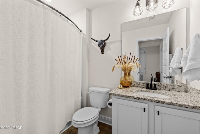 bathroom with vanity and toilet