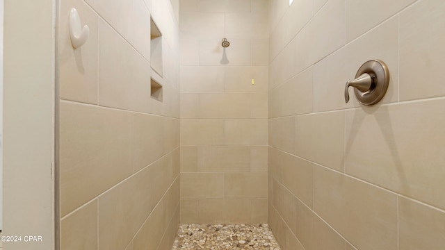 interior space featuring tiled shower