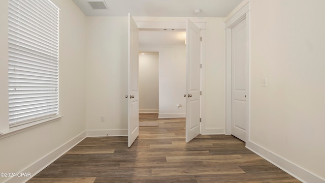 hall with dark hardwood / wood-style floors