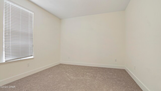 empty room featuring carpet flooring