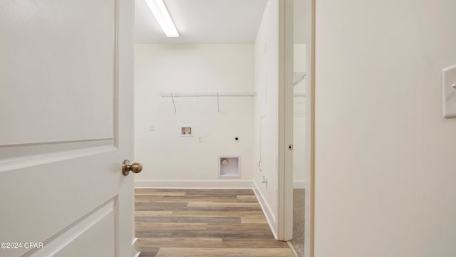 clothes washing area with washer hookup, light wood-type flooring, and electric dryer hookup