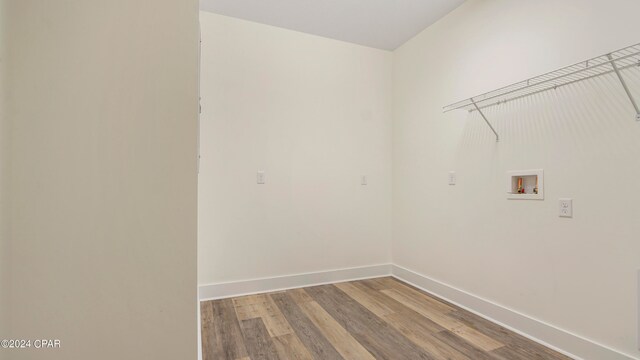 washroom with washer hookup and hardwood / wood-style flooring