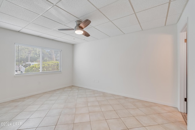 spare room featuring ceiling fan and a paneled ceiling