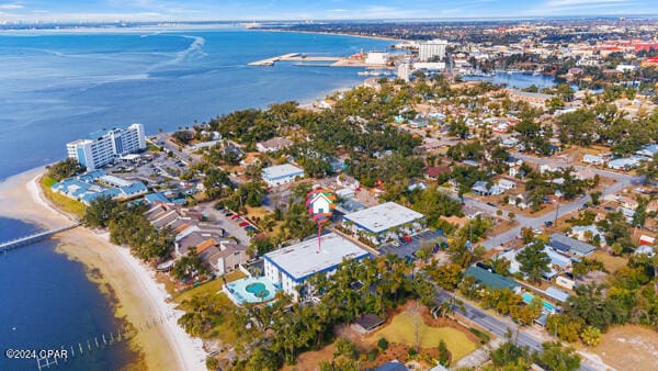 aerial view with a view of the beach and a water view