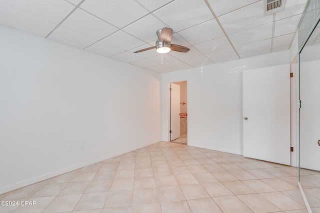 unfurnished room featuring a drop ceiling and ceiling fan