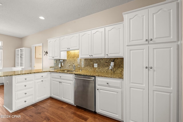 kitchen with dark hardwood / wood-style floors, kitchen peninsula, white cabinetry, and dishwasher