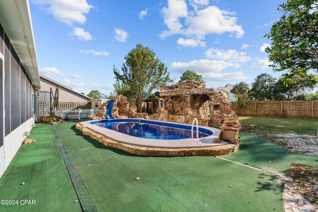 view of pool featuring a water slide