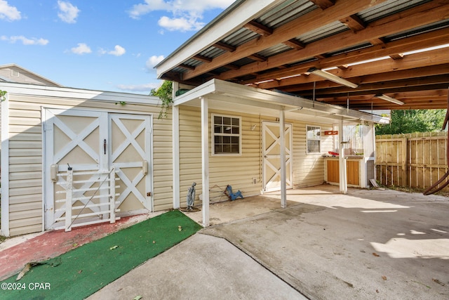 view of patio featuring a storage unit