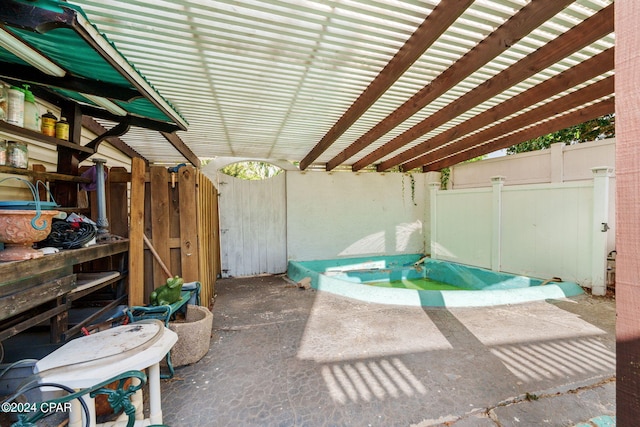 view of patio featuring a jacuzzi