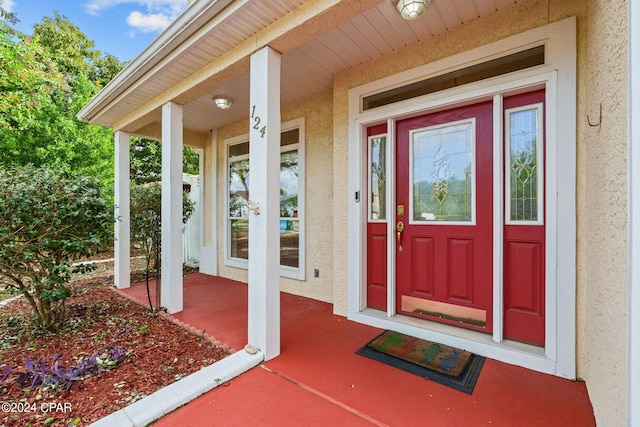 doorway to property featuring covered porch