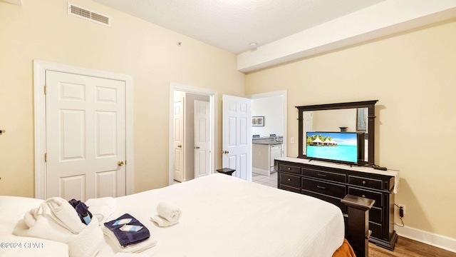 bedroom with wood-type flooring