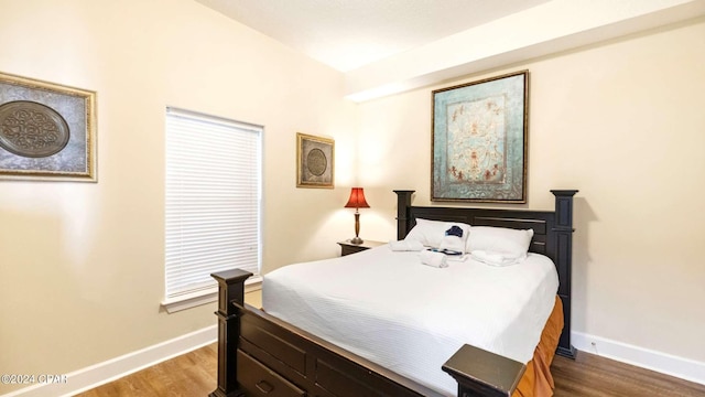 bedroom with hardwood / wood-style floors