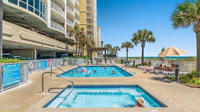 view of swimming pool with a patio