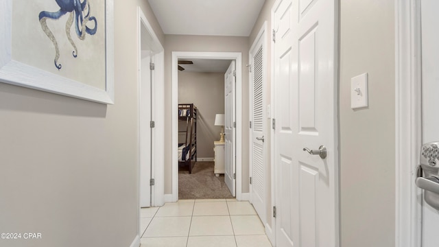 corridor with light tile patterned floors