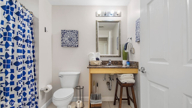 bathroom featuring a shower with shower curtain, tile patterned flooring, toilet, and sink