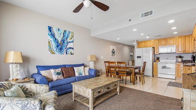 living room featuring light tile patterned flooring and ceiling fan