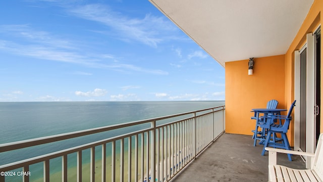 balcony featuring a water view