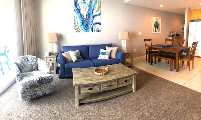 tiled living room featuring a healthy amount of sunlight