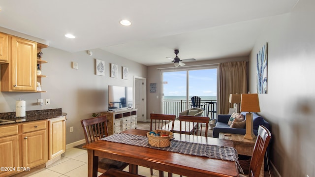 tiled dining room with ceiling fan