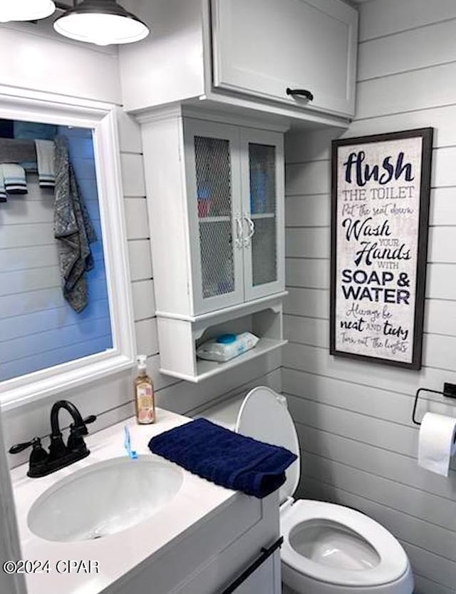 bathroom with vanity and toilet