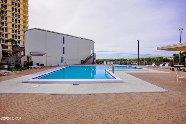 view of pool with a patio