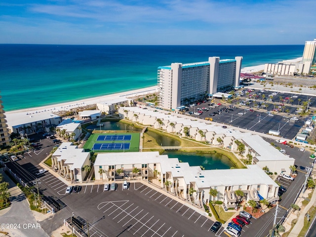 birds eye view of property with a view of the beach and a water view