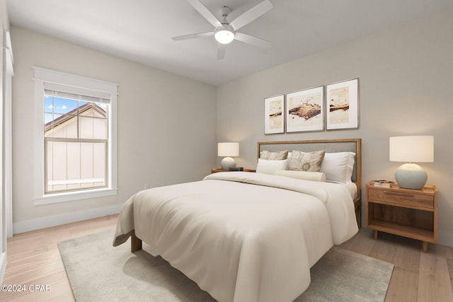 bedroom featuring ceiling fan and light hardwood / wood-style floors