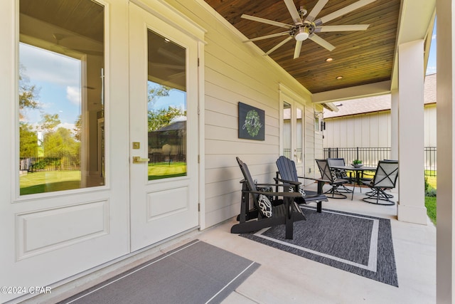 view of patio with ceiling fan, covered porch, and french doors