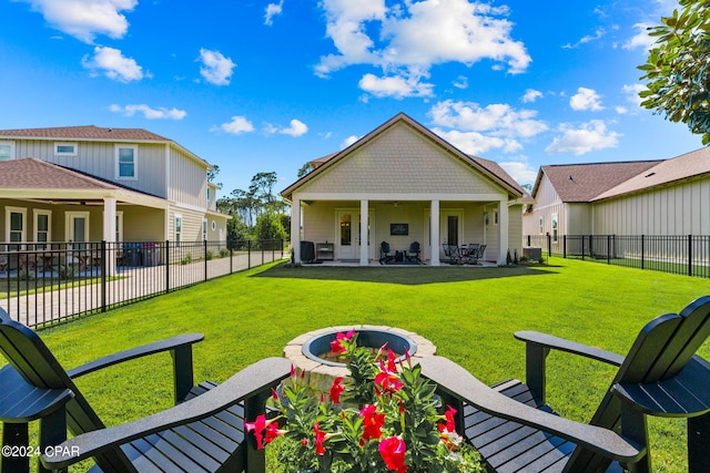 back of house featuring a yard and a patio