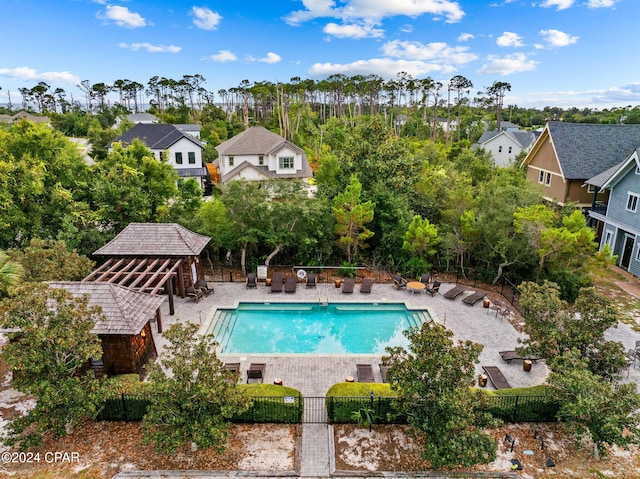 view of swimming pool with a gazebo and a patio area