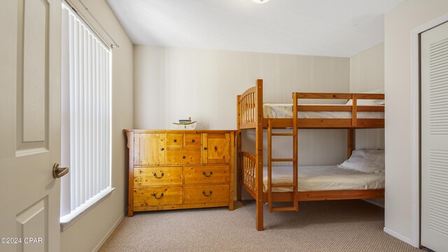 bedroom with light colored carpet