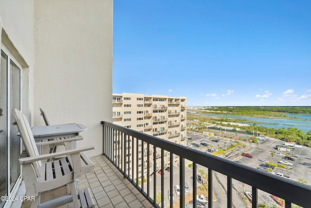 balcony featuring a water view