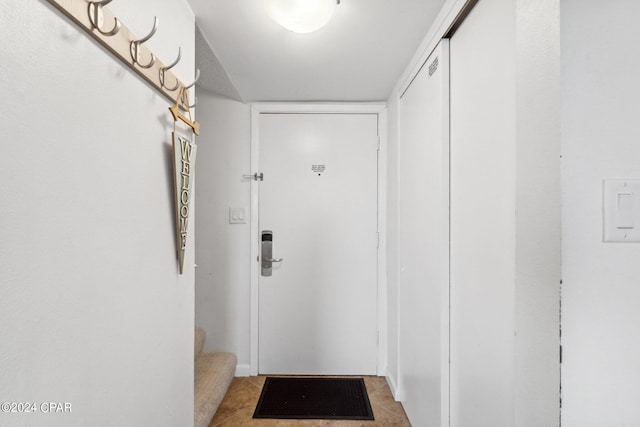 entryway featuring light tile patterned floors