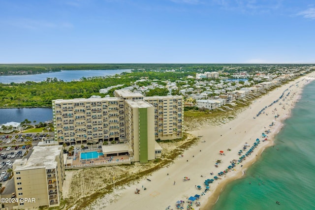 birds eye view of property with a view of the beach and a water view