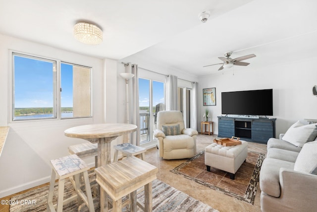 23223 Front Beach Rd Ph 4, Panama City Beach, FL 32413 - living room with a ceiling fan, baseboards, and light tile patterned floors